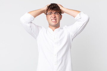 young handsome man feeling frustrated and annoyed, sick and tired of failure, fed-up with dull,...