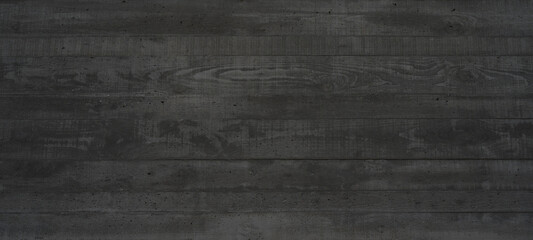 Black anthracite gray grey concrete texture wall, with wooden board structure, wallpaper background panorama banner.