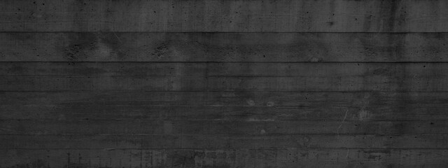 Black anthracite gray grey concrete texture wall, with wooden board structure, wallpaper background panorama banner.