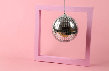 Disco ball with frame on pink background. Minimalism party concept
