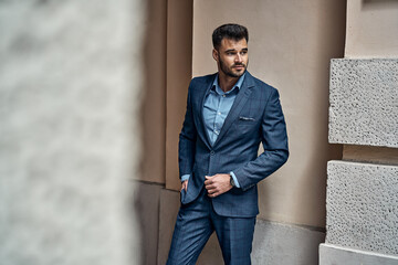 Handsome male model in classic checked suit
