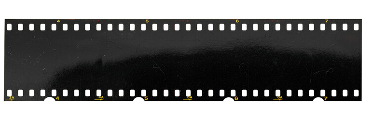 long and underexposed dia 35mm film strip isolated on white background. real positive film material.