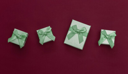 Gift boxes on red background. Top view