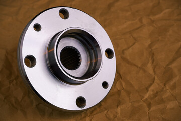 Auto parts. Car hub close-up on craft paper.