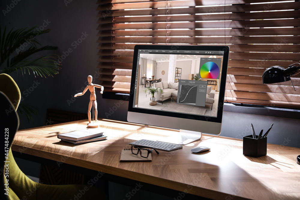 Poster designer's workplace. computer with photo editor application on table indoors