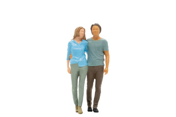 Miniature people couple in casual cloth standing together isolated on white background with clipping path.