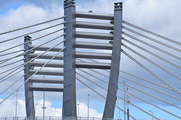 The pylons of the cable-stayed bridge connected to the road by means of metal rods