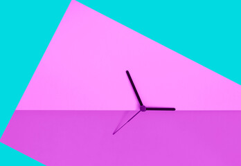 Daylight saving time concept. Clock hands on the bright turquose  pink color block background. Seasonal time change. Spring time change concept. Copy space.