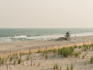 Lifeguard stand with sand dunes and view of the ocean at Fire Island, New York