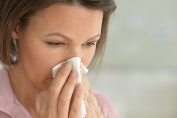 beautiful young ill woman at home