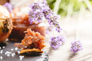 Obraz na płótnie Canvas Onion jam with lavender flavor on crackers