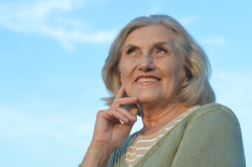  happy smiling senior woman outdoors