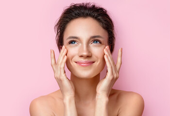 Beautiful woman with perfect skin on pink background. Beauty and skin care concept - obrazy, fototapety, plakaty