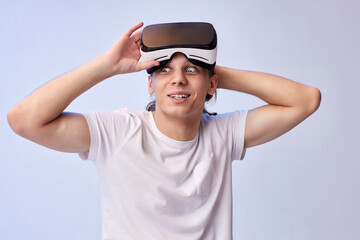 Naklejka premium Young man using virtual reality headset. VR gadgets