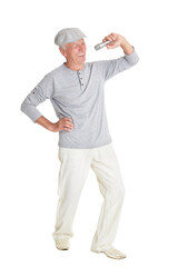 portrait of  senior man singing karaoke