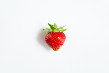 Ripe strawberry berry on a white background. 