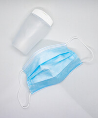 Face mask and plastic hand sanitizer