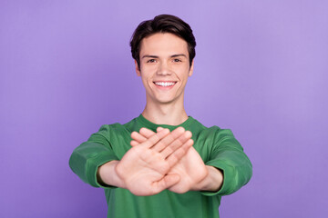 Photo of young guy happy positive smile gesture hand deny reject avoid signal isolated over violet...