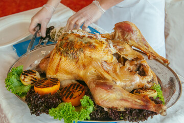 the chef carves a turkey