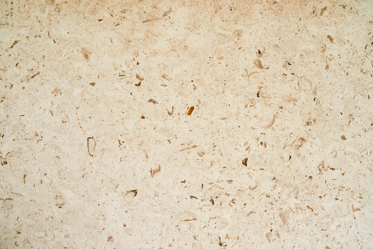Beige marble texture with splashes. Close-up