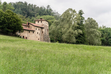 Fototapeta na wymiar medieval monastery in Olona valley green countryside, Torba, Gornate Olona, Italy