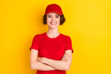 Photo of nice optimistic brown hair lady crossed arms wear t-shirt cap isolated on yellow color background