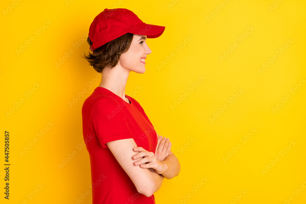 Wall mural profile photo of nice optimistic brown hair lady crossed arms wear t-shirt cap isolated on yellow ba