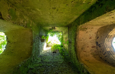 The overgrown ruins of St Mary’s church, located in a woods in East Somerton near Winterton-on-Sea, North Norfolk UK.