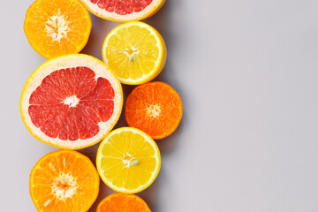 Sliced citrus on a white background. Grapefruit, lemon, tangerine.