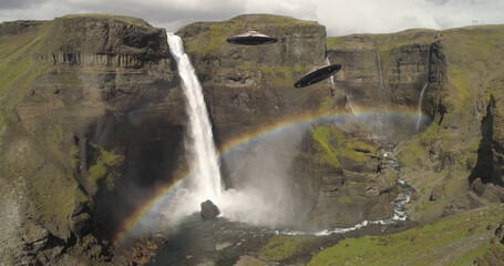 Flying Saucers Ufo Hovering Close to Waterfall,aerial,Iceland
alien invasion Concept in Europe...