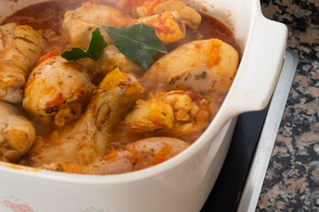 Chicken with sauce in casserole ready to eat