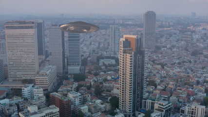 Flying Saucer ufo over large city aerial view
Large mother ship over tel aviv city,drone view 
