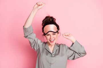 Photo of young girl happy positive smile have fun dance music party wear pajamas isolated over pink...