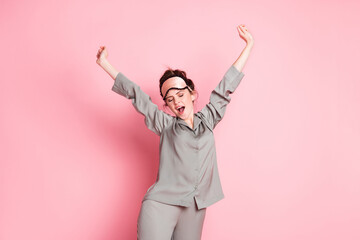 Photo of young attractive girl wakeup morning yawn stretch wear pajamas isolated over pink color...