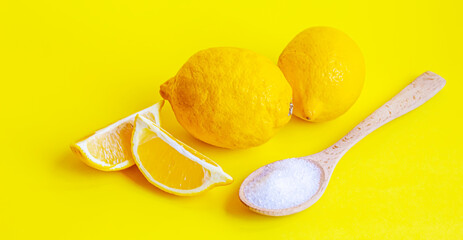Citric acid on a yellow background. Selective focus.