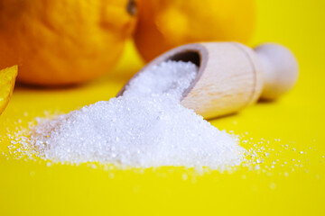 Citric acid on a yellow background. Selective focus.