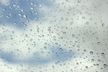 Water​ rain​ drops​ on​ glass​ background.​ Rain​ drops​ on​ a​ Windows.