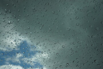 Water​ rain​ drops​ on​ glass​ background.​ Rain​ drops​ on​ a​ Windows.