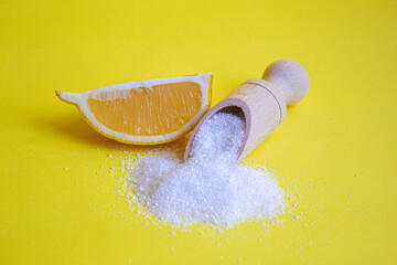 Citric acid on a yellow background. Selective focus.
