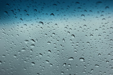 Water​ rain​ drops​ on​ glass​ background.​ Rain​ drops​ on​ a​ Windows.
