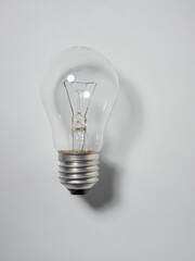 Modern glowing lamp bulb on white background