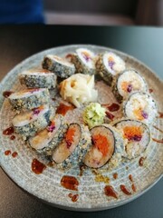 fried rolls in a circle on a round plate. top view. delicious Japanese food.