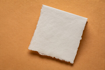 small sheet of blank white Khadi rag paper from South India orange handmade paper