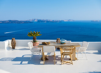 A restaurant overlooking caldera, Santorini Island, Greece. Lunch and dinner overlooking the sea....