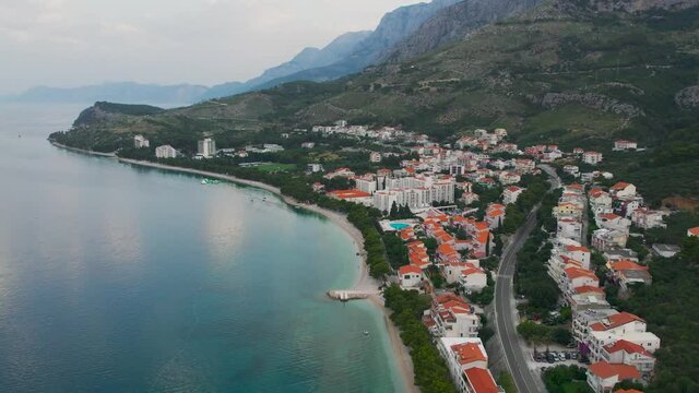 CROATIA - July 2021 - Beautiful aerial over the Tucepi coast, Makarska riviera in the morning. Right coast