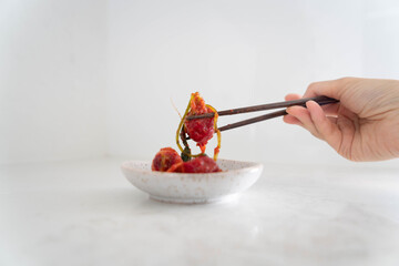 person holding a kimchi