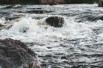 Rocky fast river. Running water, flowing with rapids .