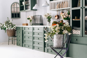 Kitchen in green white theme full of flowers