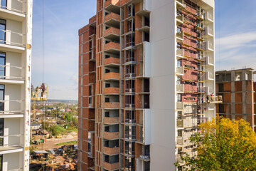 Aerial view of multi storey residential apartment buildings under construction. Real estate...