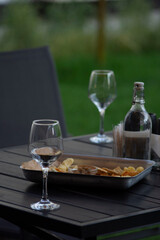 Wine glass on the dinner table. Liquid concept design. Wine tasting– wine degustation set. 